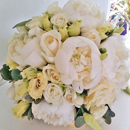 Flowers. Bridal bouquet of white peonies, roses and lisianthus.

A wedding is a special event. bridal bouquet