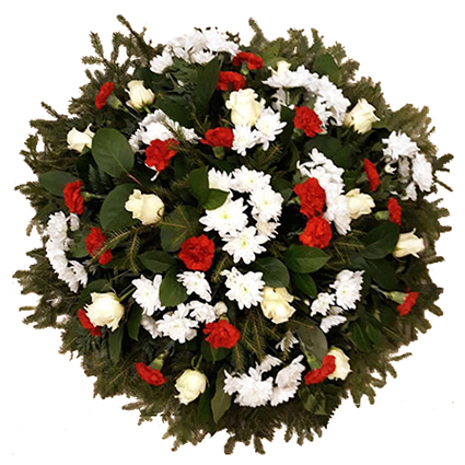 Flowers. Funeral wreath with white roses, red carnations, white chrysanthemums and decorative foliage.