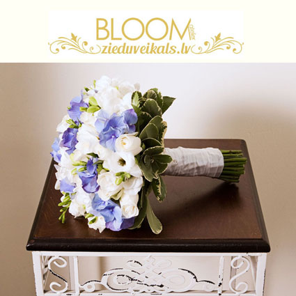 Flower delivery. Bridal bouquet of white roses, white freesias and blue hydrangeas.

A wedding is a special event and each