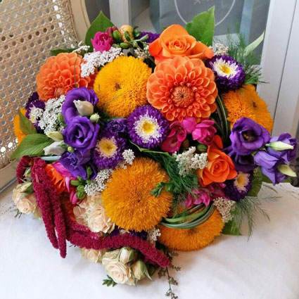 Flowers on-line. Bridal bouquet in bright colors, made of summer flowers: dahlias, asters, sunflowers.

A wedding
