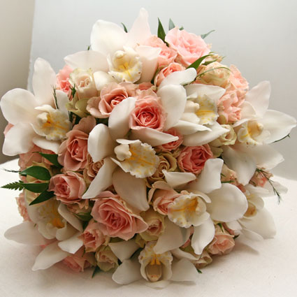 Flower delivery. Bridal bouquet of light pink spray roses and white orchids.

A wedding is a special event